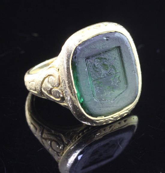An antique style continental 18k gold and green tourmaline intaglio ring, size E.